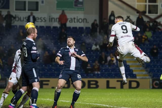 Motherwell's Louis Moult scores the winner against Ross County. Picture: Paul Devlin/SNS