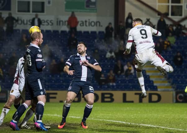 Motherwell's Louis Moult scores the winner against Ross County. Picture: Paul Devlin/SNS