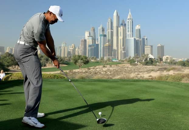 Tiger Woods tees of at the eighth at Emirates Golf Club in this morning's Omega Dubai Desert Classic pro-am. Picture: Getty Images