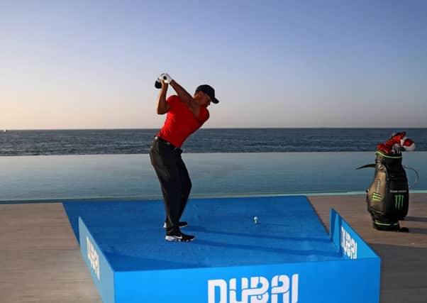 Tiger Woods plays a shot into the Gulf from a hotel ahead of the Omega Dubai Desert Classic at Emirates Golf Club in Dubai, United Arab Emirates.  Picture: Warren Little/Getty