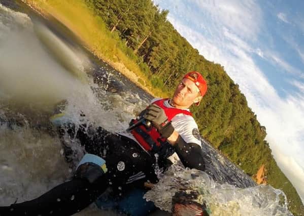 Canoeist Ted Simpson setting a new record for the fastest descent of the River Spey