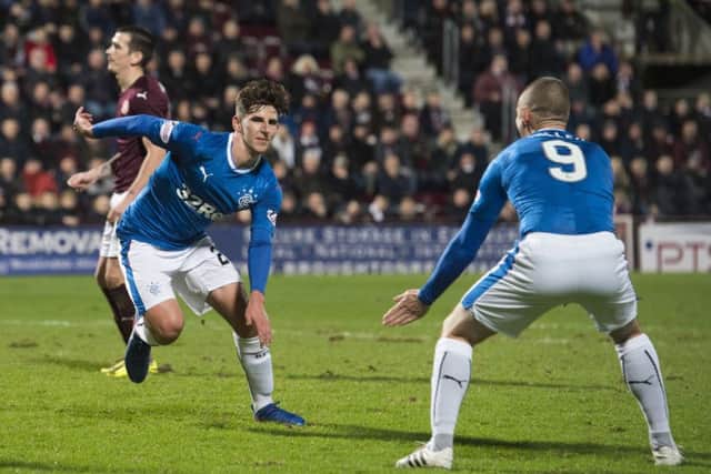 Rangers' Emerson Hyndman (left) wheels away after equalising for the away side. Picture: SNS
