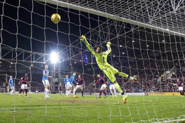 Krystian Nowak's header evades the desperate dive of Wes Foderingham as the hosts open the scoring. Picture: SNS