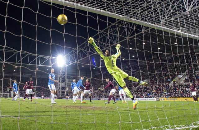 Krystian Nowak's header evades the desperate dive of Wes Foderingham as the hosts open the scoring. Picture: SNS