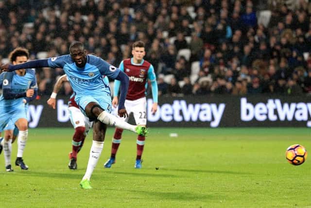 Manchester City's Yaya Toure scores his side's fourth goal against West Ham from the penalty spot at the London Stadium. Picture: Adam Davy/PA