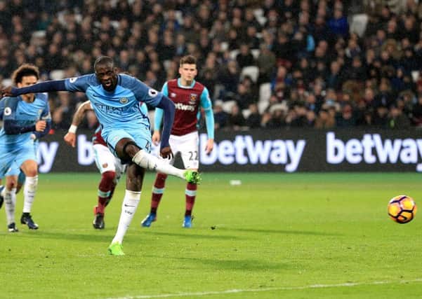 Manchester City's Yaya Toure scores his side's fourth goal against West Ham from the penalty spot at the London Stadium. Picture: Adam Davy/PA