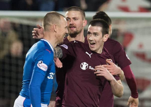Jamie Walker, right, shares a laugh with Kenny Miller of Rangers. Picture: SNS