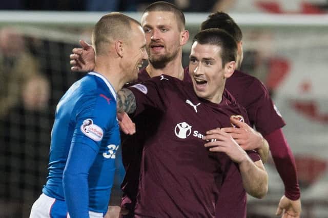Jamie Walker, right, shares a laugh with Kenny Miller of Rangers. Picture: SNS