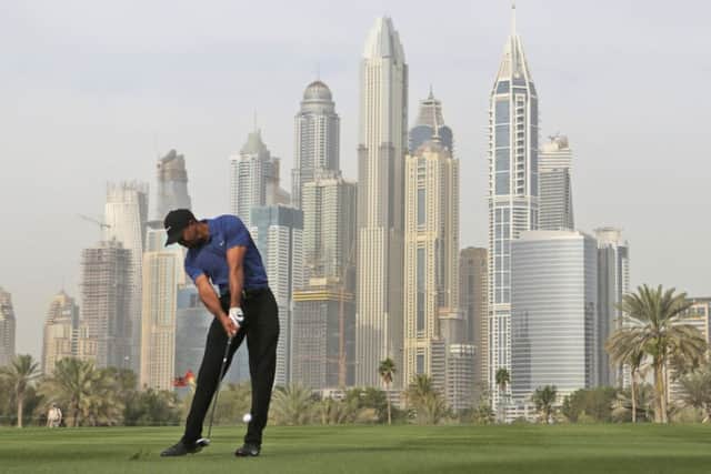 Tiger Woods hits his second at the 13th at the Emirates Golf Club in Dubai. Picture: Getty Images