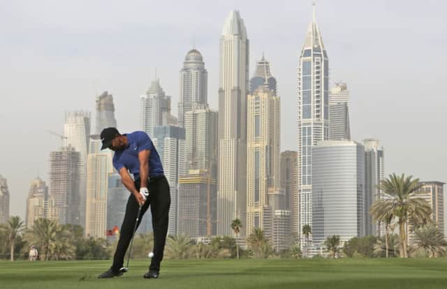 Tiger Woods hits his second at the 13th at the Emirates Golf Club in Dubai. Picture: Getty Images