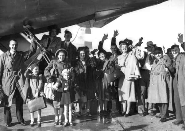 NEW LIFE: Families wave goodbye from London Airport in 1948 for a new life in Australia. Picture: Getty