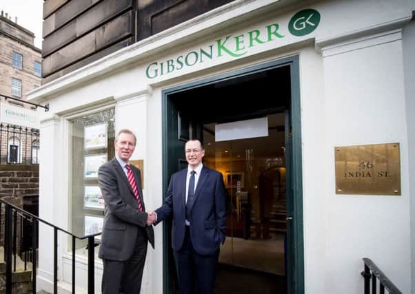 Grange's Gregor Mair, left, shakes hands on the deal with Scott Rasmusen of Gibson Kerr. Picture: Contributed