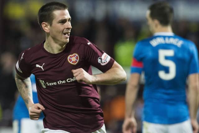 Jamie Walker turns away to celebrate after scoring the first of his two goals against Rangers. Picture: SNS.