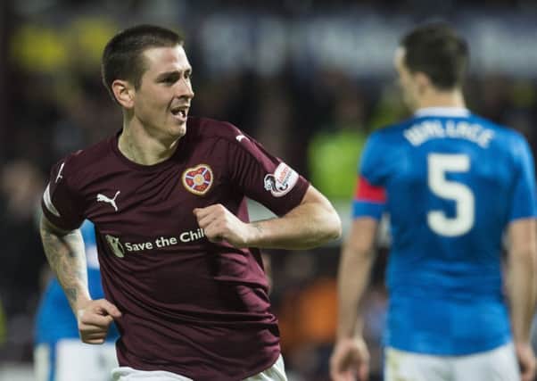 Jamie Walker turns away to celebrate after scoring the first of his two goals against Rangers. Picture: SNS.