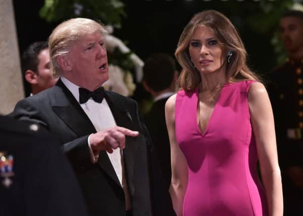 US President Donald Trump and First Lady Melania Trump arrive for the 60th Annual Red Cross Gala at his Mar-a-Lago estate in Palm Beach. Picture: Getty
