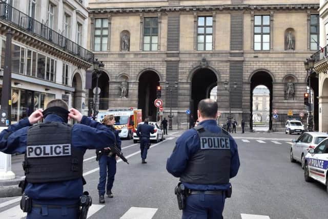 French police officers patrol near the Louvre museum Picture: Getty Images