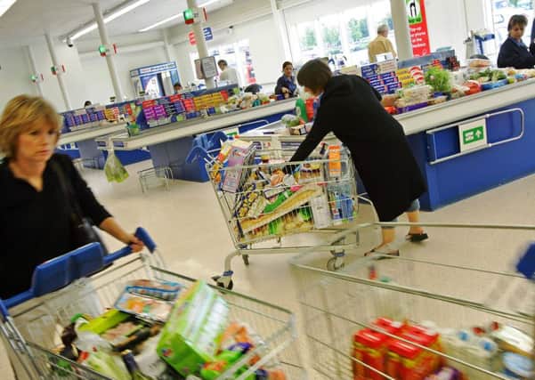 After several years of retreat, food retailing's Big Four are mounting a fightback, writes Martin Flanagan. Picture: Adrian Dennis/AFP/Getty Images