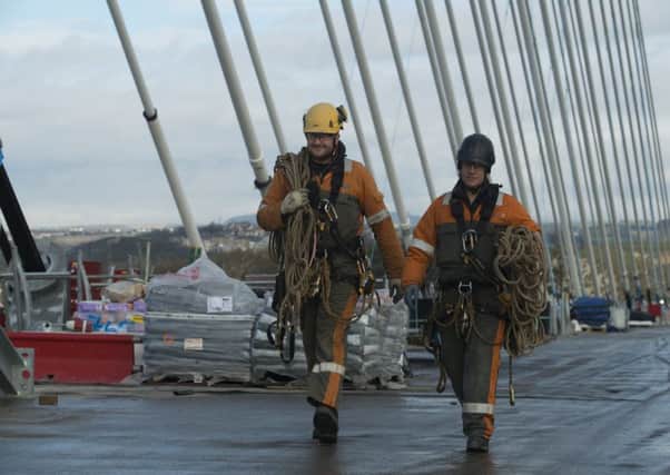 Workers in harness on the deck of the new bridge. Picture: Andrew O'Brien