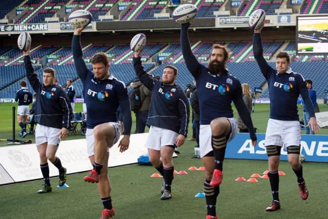 Scotland's Mark Bennett,  Ross Ford, Zander Ferguson, Josh Strauss and Grant Gilchrist limber up during the captain's run at Murrayfield. Picture: Ian Rutherford/PA Wire