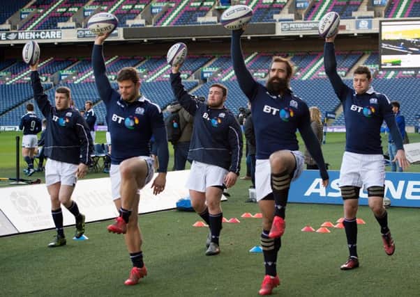 Scotland's Mark Bennett,  Ross Ford, Zander Ferguson, Josh Strauss and Grant Gilchrist limber up during the captain's run at Murrayfield. Picture: Ian Rutherford/PA Wire