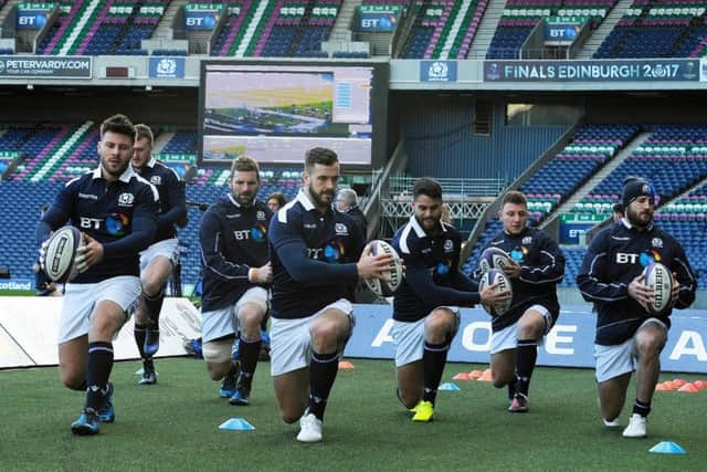 Scotland players stretch off during the captain's run training session at Murrayfield. Picture: Andy Buchanan/AFP/Getty Images