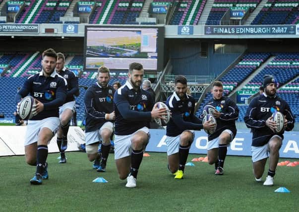 Scotland players stretch off during the captain's run training session at Murrayfield. Picture: Andy Buchanan/AFP/Getty Images