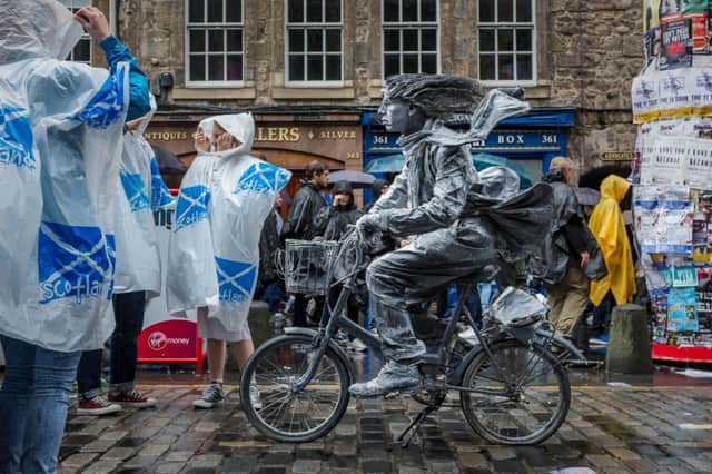 A street performer on the Royal Mile during the 2016 Edinburgh festivals. Picture: Steven Scott Tyalor/JP Resell