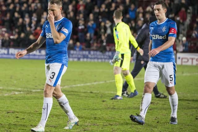 No case for the defence: Clint Hill, left, and Lee Wallace are shell-shocked after Rangers capitulation. Photograph: Jeff Holmes/PA