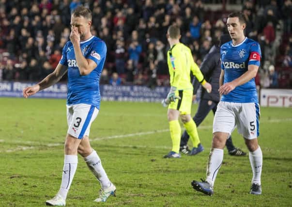 No case for the defence: Clint Hill, left, and Lee Wallace are shell-shocked after Rangers capitulation. Photograph: Jeff Holmes/PA