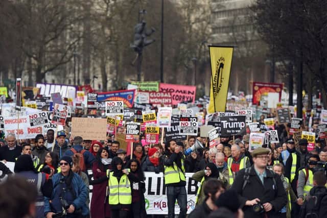 Demonstrators march to Downing Street, as they protest against US President Donald Trump's travel ban. Picture; David Mirzoeff/PA