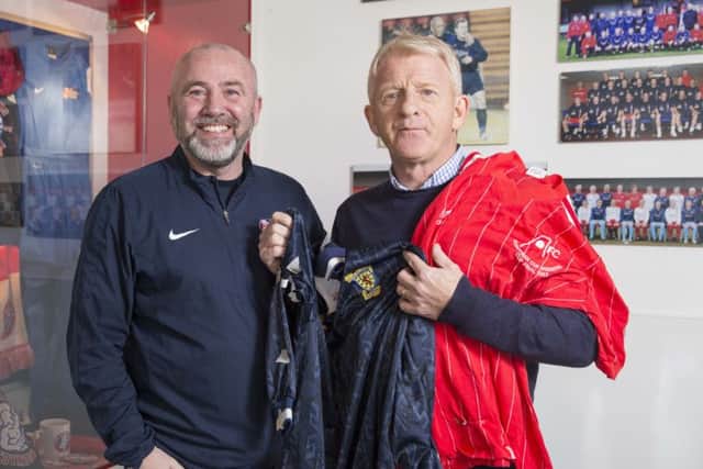 Scotland manager Gordon Strachan gives Spartans chief executive Douglas Samuel memorabilia from his successful playing career. Photograph: Jeff Holmes