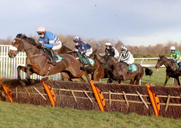 Diego Du Charmil, ridden by Harry Cobden, wins the Scottish County Hurdle.  Photograph: Grossick Racing