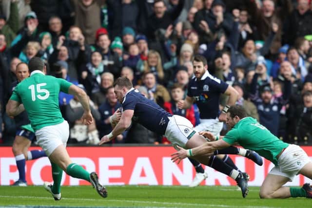 Stuart Hogg opens the scoring in Scotland's defeat of Ireland. Picture: PA