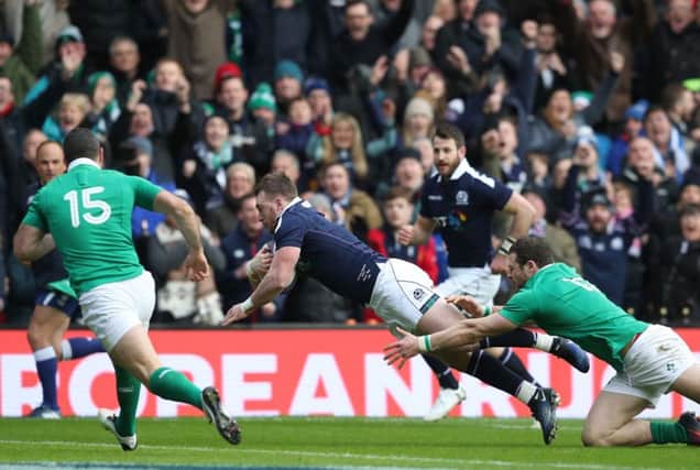 Stuart Hogg opens the scoring in Scotland's defeat of Ireland. Picture: PA