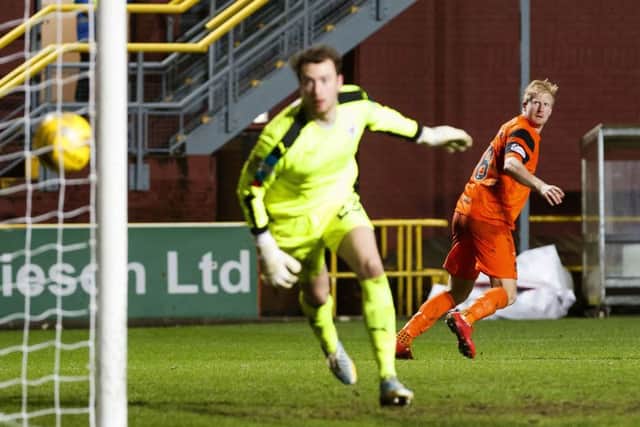 Dundee United's Thomas Mikkelsen scored with headers in each half. Picture: Roddy Scott/SNS