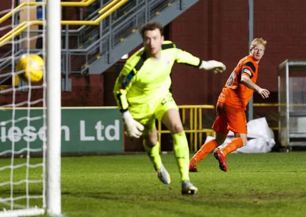 Dundee United's Thomas Mikkelsen scored with headers in each half. Picture: Roddy Scott/SNS