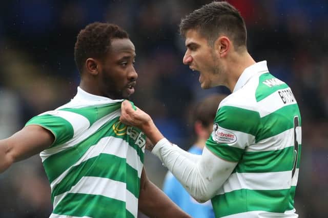 Moussa Dembele celebrates with Nir Bitton, right, after scoring from the spot. Picture: Getty