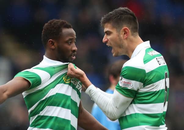 Moussa Dembele celebrates with Nir Bitton, right, after scoring from the spot. Picture: Getty