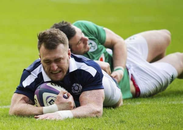 Stuart Hogg crosses for Scotland's first try. Picture: SNS.