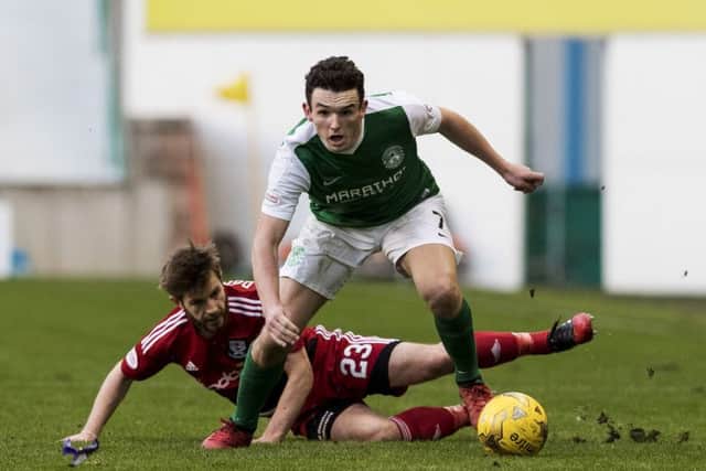 Hibernian midfielder John McGinn gets the better of Ayr Uniteds Ross Docherty. Picture: SNS.
