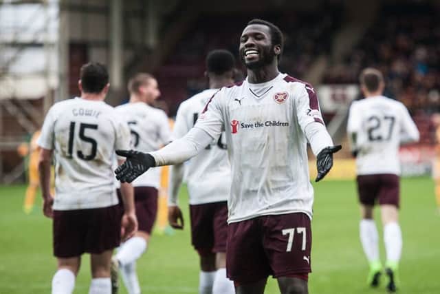 Esmael Goncalves, who scored his first two goals for Hearts, celebrates in front of the visiting fans. Picture: SNS.