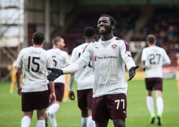 Esmael Goncalves, who scored his first two goals for Hearts, celebrates in front of the visiting fans. Picture: SNS.