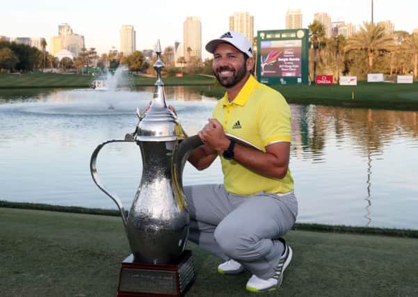 Sergio Garcia poses with the trophy after winning the Omega Dubai Desert Classic. Picture: AFP/Getty Images