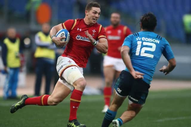 ROME, ITALY - FEBRUARY 05: George North of Wales goes past Luke McLean of Italy to score his team's third try during the RBS Six Nations match between Italy and Wales at the Stadio Olimpico on February 5, 2017 in Rome, Italy. (Photo by David Rogers/Getty Images)