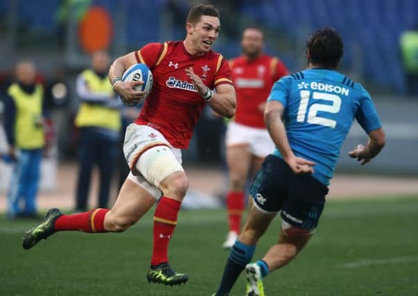 ROME, ITALY - FEBRUARY 05: George North of Wales goes past Luke McLean of Italy to score his team's third try during the RBS Six Nations match between Italy and Wales at the Stadio Olimpico on February 5, 2017 in Rome, Italy. (Photo by David Rogers/Getty Images)