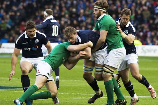 Scotland's Jonny Gray weathers an Irish tackle. Picture: SNS