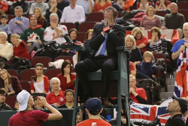 Denis Shapovalov tries to apologise to umpire Arnaud Gabas after he hit the official in the eye with a ball in Canada's Davis Cup tie with Great Britain. Pic: Getty