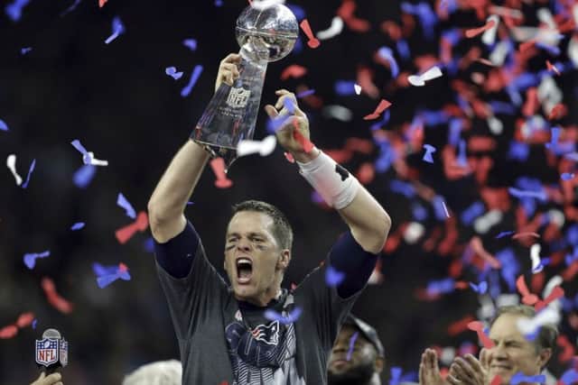 New England Patriots' Tom Brady raises the Vince Lombardi Trophy after defeating the Atlanta Falcons in overtime. Pic: Getty