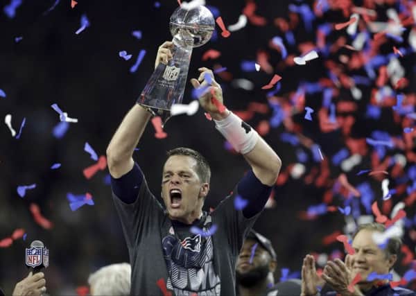 New England Patriots' Tom Brady raises the Vince Lombardi Trophy after defeating the Atlanta Falcons in overtime. Pic: Getty