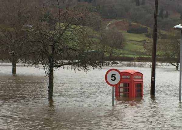 Flooding in the village of Aberfeldy, Perthshire, Scotland, as as Storm Frank begins to batter the UK on its way towards flood-hit areas. PRESS ASSOCIATION Photo. Picture date: Wednesday December 30, 2015. The latest storm to sweep the country caused widespread disruption in Northern Ireland, with thousands of homes experiencing power cuts. See PA story WEATHER Floods. Photo credit should read: Catriona Webster/PA Wire
